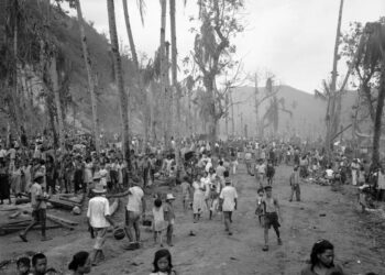 In this August 1944 file photo, people of Guam pour out of the hills into the Agana refugee camp. (Joe Rosenthal/AP)