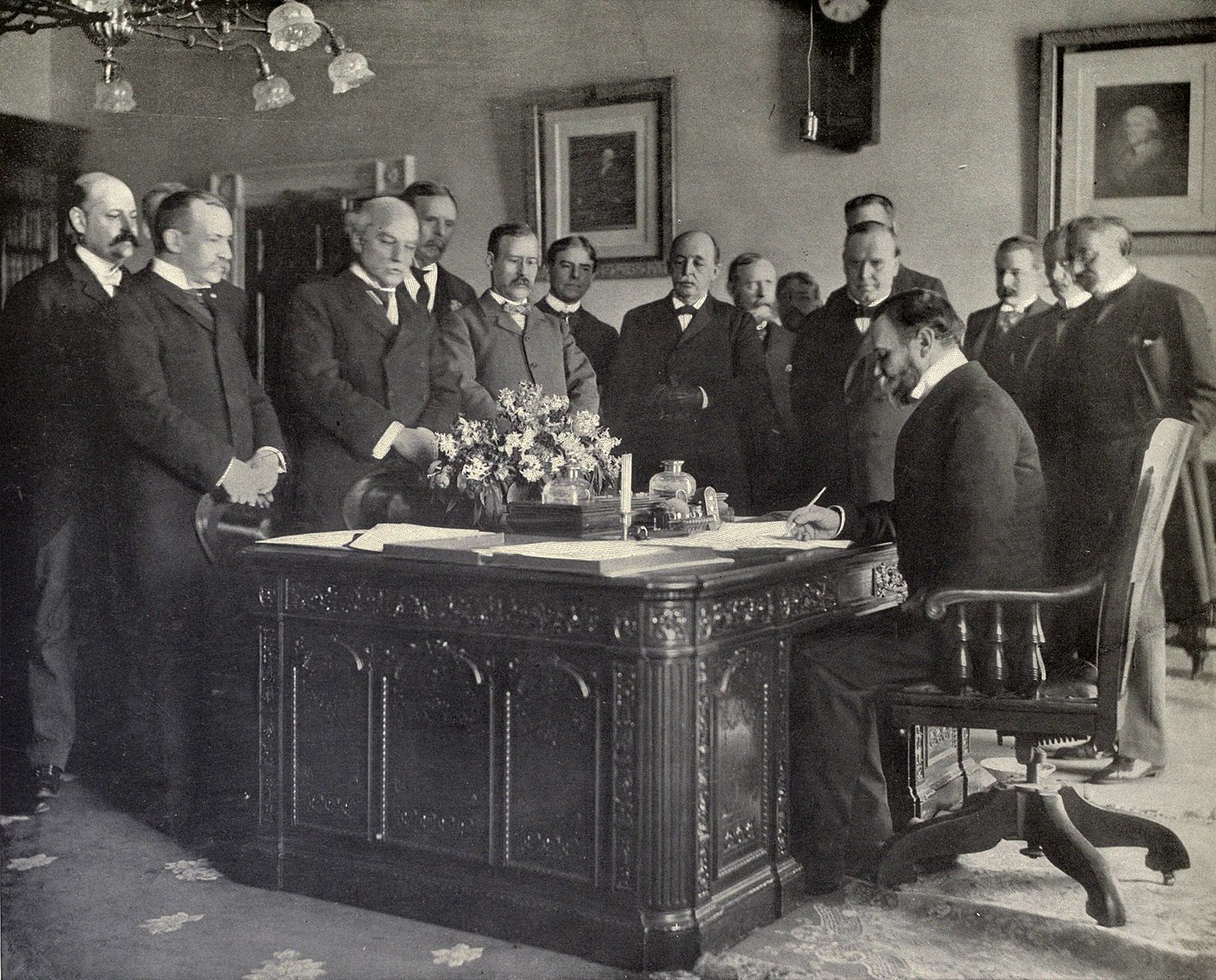 Secretary John Hay signing the memorandum