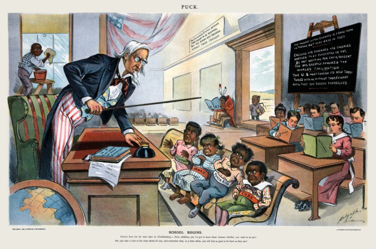 An 1899 Puck Magazine cartoon shows Uncle Sam lecturing four children labelled Philippines (who appears similar to Philippine leader Emilio Aguinaldo), Hawaii, Porto[sic] Rico and Cuba in front of children holding books labelled with various U.S. states. In the background are an American Indian holding a book upside down, a Chinese boy at the door and a black boy cleaning a window.